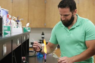 Student using bunsen burner